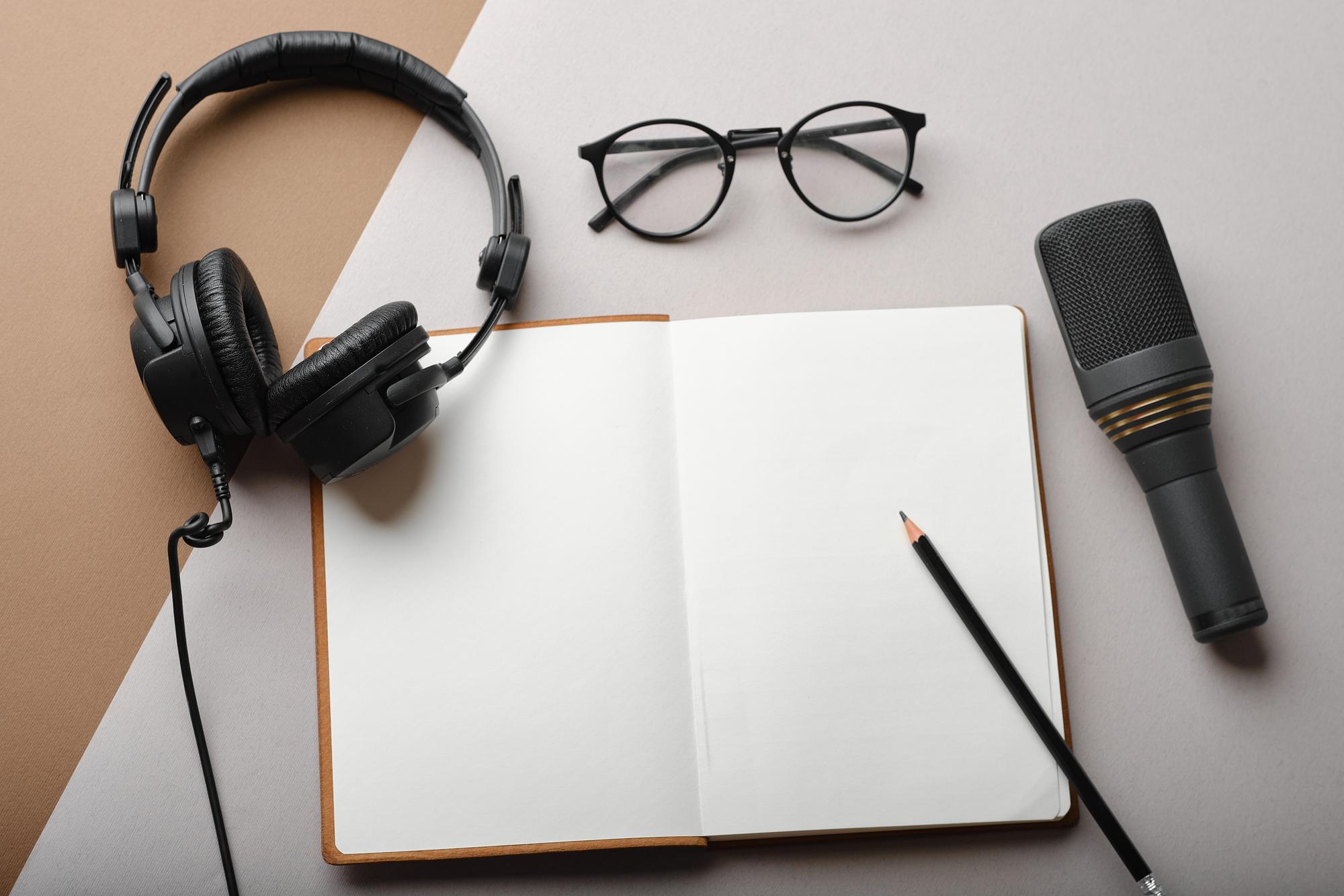 Editorial workspace with notes and microphone