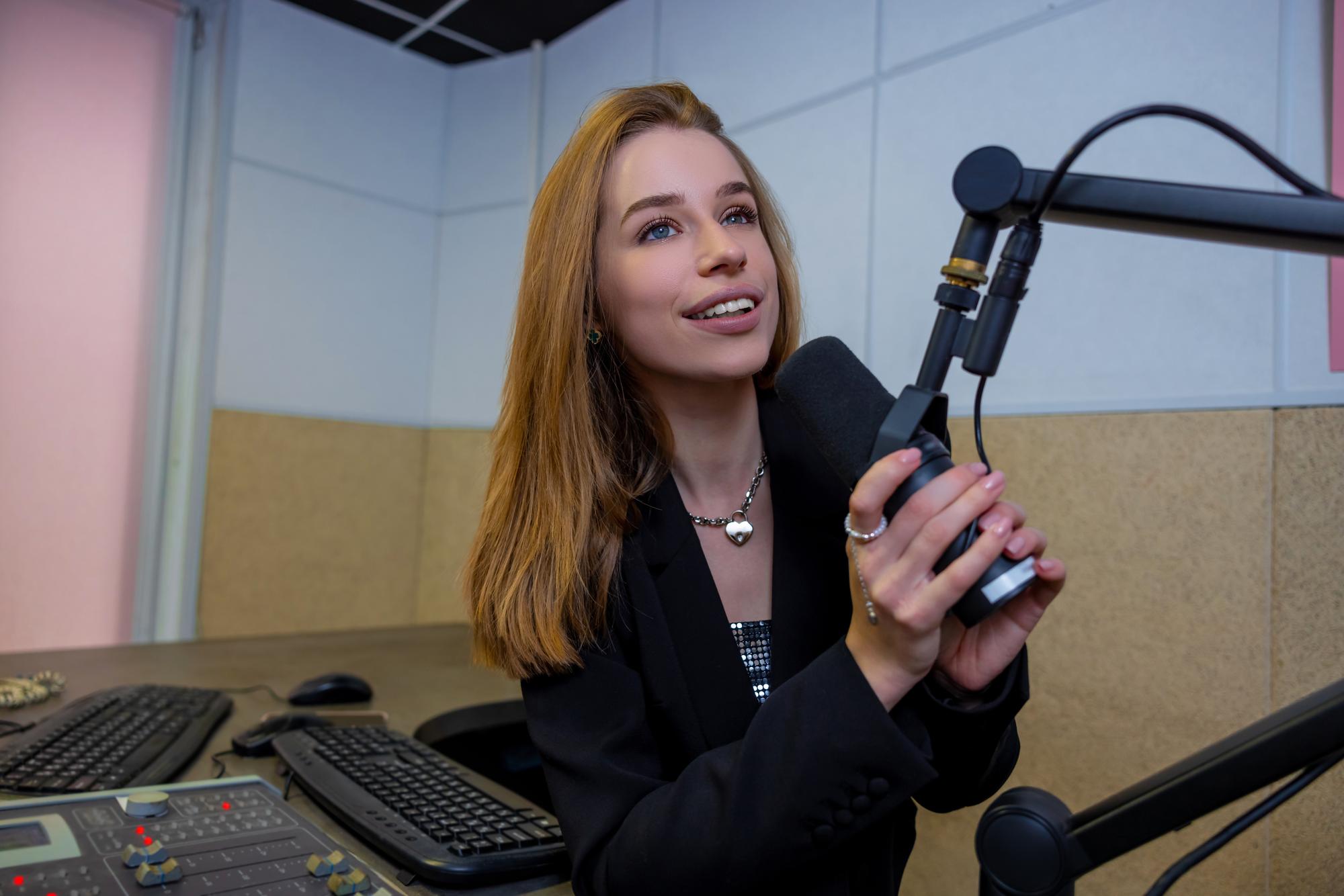 Interviewer conducting a focused studio interview